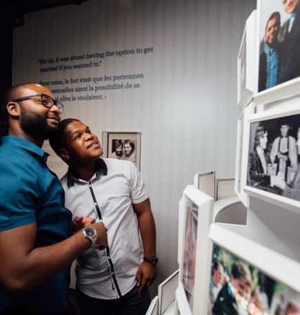 Two people viewing an exhibit at the Canadian Museum for Human Rights.
